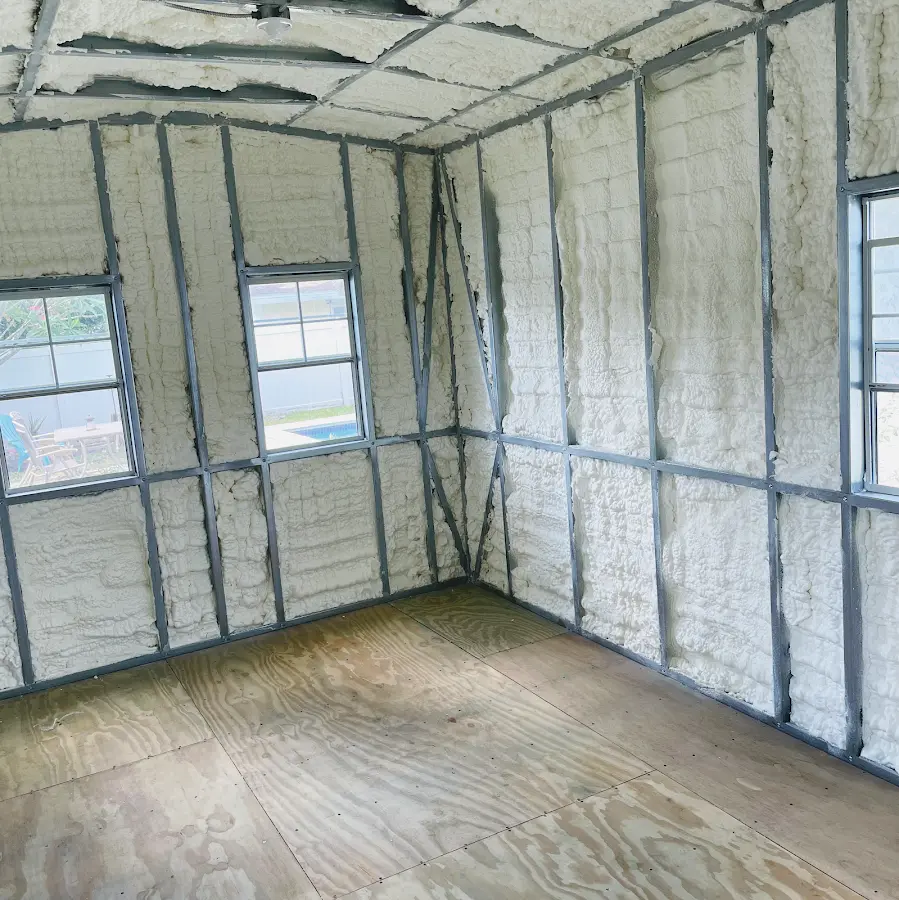 Closed-cell spray foam insulation applied to wall cavities in a residential project in Sallisaw
